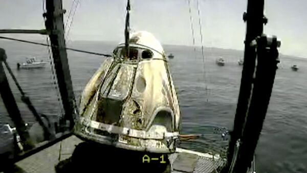 Skrinšot sa snimka agencije NASA. Kapsula sa astronautima nakon sletanja u Meksički zaliv - Sputnik Srbija