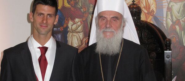 Новак Ђоковић и патријарх Иринеј након уручења Ордена Светог Саве 2011. - Sputnik Србија