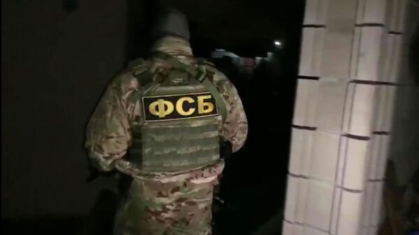 Pripadnik FSB tokom operacije privođenja članova terorističke organizacije - Sputnik Srbija
