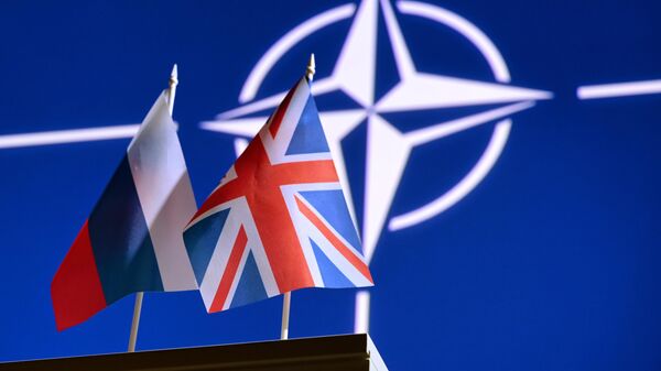 Britanski ministar odbrane saveznicima: Prenite se, shvatite kakva opasnost preti od Rusije i Kine - Sputnik Srbija