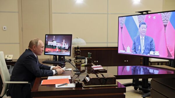 Руски председник Владимир Путин током разговора са кинеским лидером Си Ђинпингом - Sputnik Србија