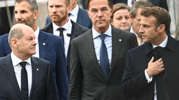 Kancelar Nemačke Olaf Šolc, premijer Holandije Mark Rute i predsednik Francuske Emanuel Makron - Sputnik Srbija