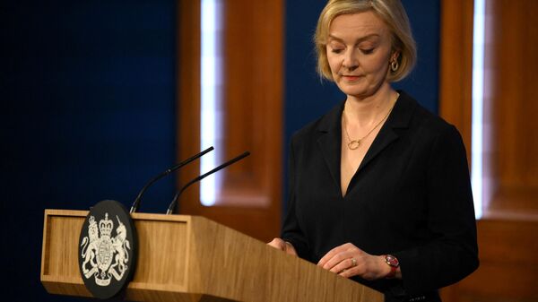 Britain's Prime Minister Liz Truss looks down during a press conference in the Downing Street Briefing Room in central London on October 14, 2022 - Sputnik Србија