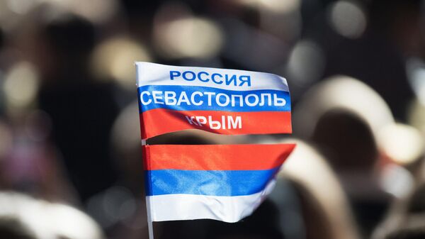 Руска тробојка на прослави годишњице уједињења Крима са Русијом - Sputnik Србија