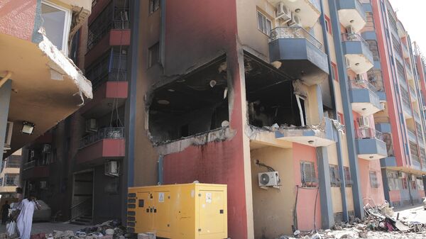 Жилые дома, поврежденные в ходе боевых действий в Хартуме, Судан - Sputnik Србија