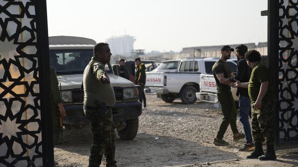 Pripadnici iračke šiitske milicije u Bagdadu - Sputnik Srbija