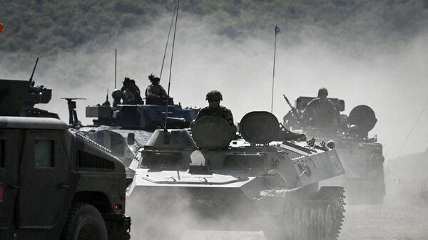 Servicemen drive armoured vehicles as they take part in the NATO Noble Blueprint 23 joint military exercise at the Novo Selo military ground, northwestern Bulgaria, on September 26, 2023.  - Sputnik Србија
