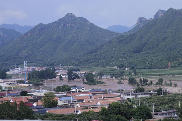 Обилне кише почеле су током викенда и интензивирале се око Пекинга и околних провинција у понедељак, а количина падавина достигла је и до 543,4 милиметра у северним деловима града града. - Sputnik Србија