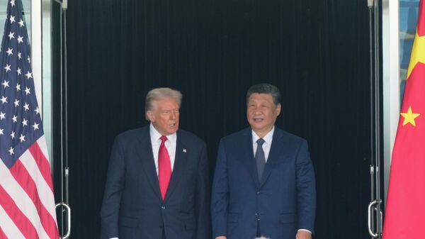 Američki predsednik Donald Tramp i kineski predsednik Si Đinping - Sputnik Srbija