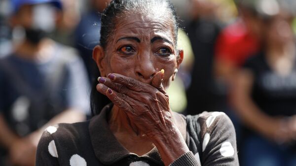 Žena snimljena u Karakasu posle američke intervencije - Sputnik Srbija
