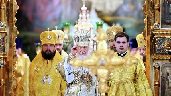 Патриарх Московский и всея Руси Кирилл проводит богослужение в храме Христа Спасителя в Москве в праздник Рождества Христова, Россия  - Sputnik Србија