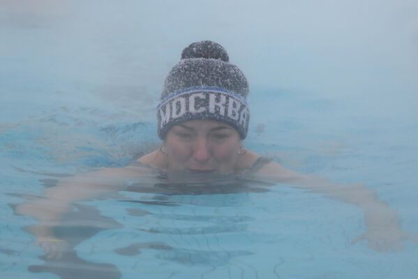 Поред топле воде пливачима је ипак потребна капа. - Sputnik Србија