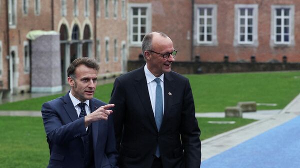 nemački kancelar Fridrih Merc i francuski predsednik Emanuel Makron - Sputnik Srbija