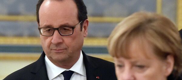 Fransoa Oland i Angela Merkel Fransoa Oland i Angela Merkel - Sputnik Srbija