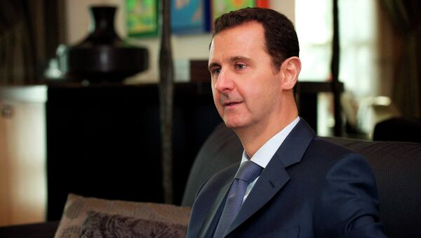 Syria's President Bashar al-Assad is seen during an interview with the American magazine Foreign Affairs published in Damascus January 26, 2015 - Sputnik Srbija