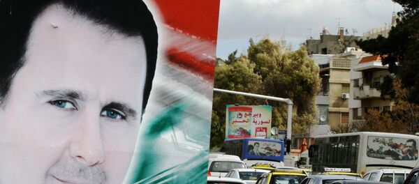 Bilbord sa portretom sirijskig predsednika Bašara el Asada u gradu Damasku - Sputnik Srbija