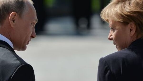 Председник Владимир Путин и канцлерка Немачке Ангела Меркел - Sputnik Србија