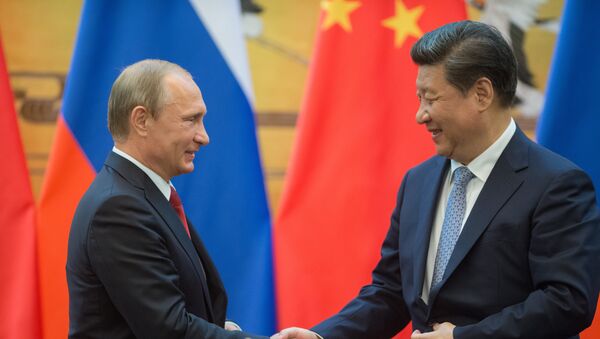 Ruski predsednik Vladimir Putin (levo) i predsednik Narodne Republike Kine Si Đinping - Sputnik Srbija