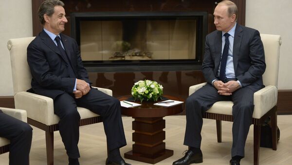 Председник Русије Владимир Путин и бивши председник Француске Никола Саркози - Sputnik Србија