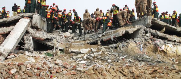 Пакистан несрећа у фабрици Пакистан несрећа у фабрици - Sputnik Србија