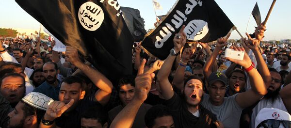 In this Sept. 21, 2012 file photo, Libyan followers of Ansar al-Shariah Brigades and other Islamic militias, hold a demonstration against a film and a cartoon denigrating the Prophet Muhammad in Benghazi, Libya In this Sept. 21, 2012 file photo, Libyan followers of Ansar al-Shariah Brigades and other Islamic militias, hold a demonstration against a film and a cartoon denigrating the Prophet Muhammad in Benghazi, Libya - Sputnik Србија