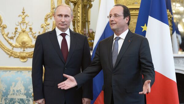 Ruski predsednik Vladimir Putin i francuski predsednik Fransoa Oland - Sputnik Srbija
