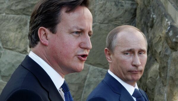 Predsednik Rusije Vladimi Putin i britanski premijer Dejvid Kameron - Sputnik Srbija