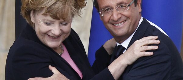 Predsednik Francuske Fransoa Oland i kanclerka Nemačke Angela Merkel - Sputnik Srbija
