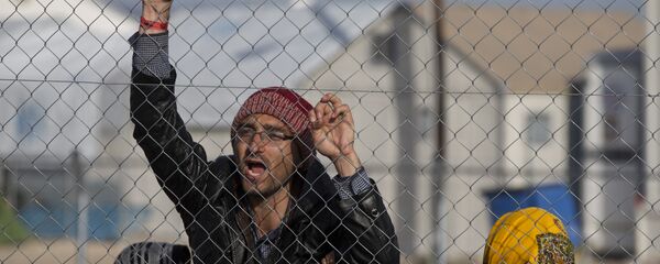 Avganistanski migranti na severnoj grčkoj granici u mestu Idomeni, utorak, 23. februara, 2016 - Sputnik Srbija