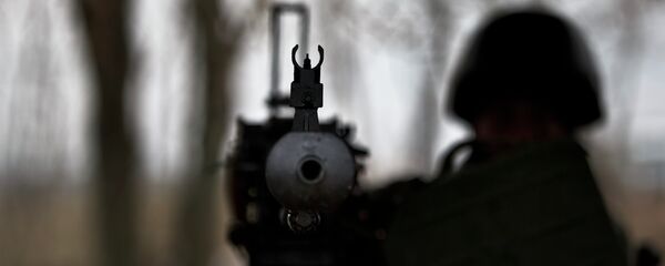 Ukrajinski vojnik sa mitraljezom Ukrajinski vojnik sa mitraljezom - Sputnik Srbija