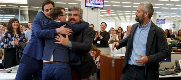 Фотографи Њујорк тајмса славе Пулицерову награду Фотографи Њујорк тајмса славе Пулицерову награду - Sputnik Србија