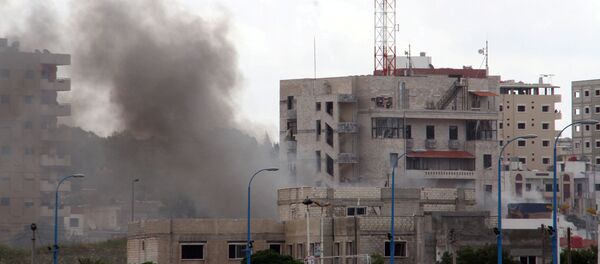 Дим након експлозије у сиријском граду Тартусу - Sputnik Србија