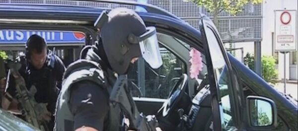 Немачка полиција испред биоскопа у ком се десила пуцњава 23.06.2016. године Немачка полиција испред биоскопа у ком се десила пуцњава 23.06.2016. године - Sputnik Србија