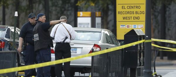 Crime scene investigators survey the area after a shooting in downtown Dallas, Friday, July 8, 2016. Crime scene investigators survey the area after a shooting in downtown Dallas, Friday, July 8, 2016. - Sputnik Србија