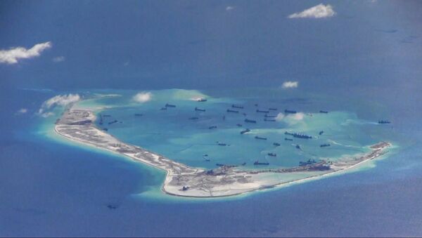 Chinese dredging vessels are purportedly seen in the waters around Mischief Reef in the disputed Spratly Islands in the South China Sea.file photo - Sputnik Srbija