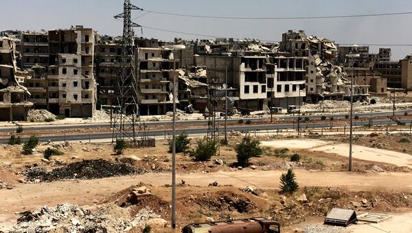 Oštećene zgrade u okrugu Ramuseh u Alepu. - Sputnik Srbija