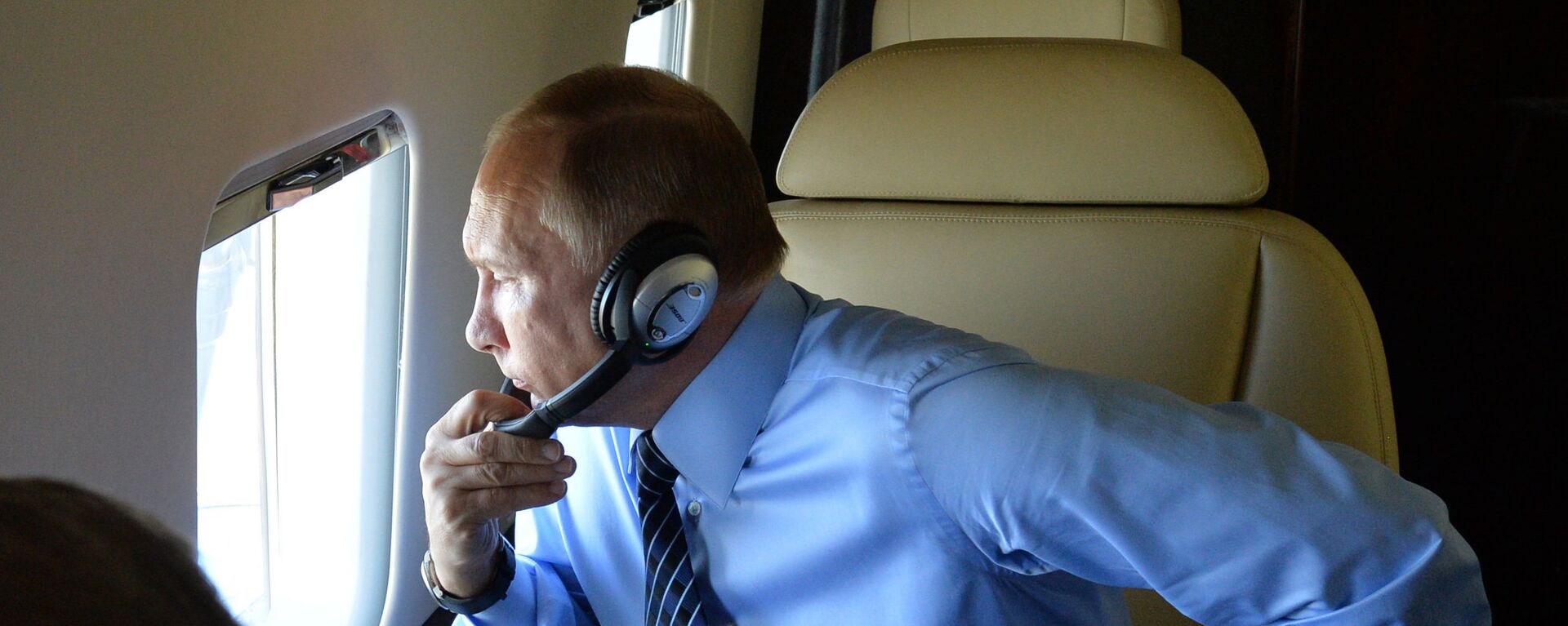 Председник Русије Владимир Путин у авиону - Sputnik Србија, 1920, 18.11.2018
