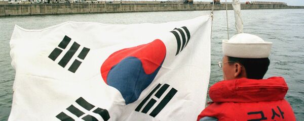 Južnokorejski oficir pored zastave svoje zemlje - Sputnik Srbija