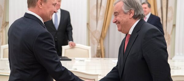 Руски председник Владимир Путин и генерални секретар УН Антонио Гутереш - Sputnik Србија