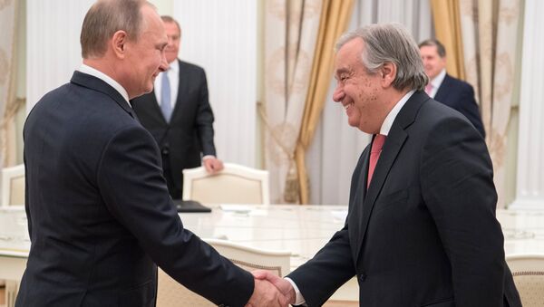 Руски председник Владимир Путин и генерални секретар УН Антонио Гутереш - Sputnik Србија