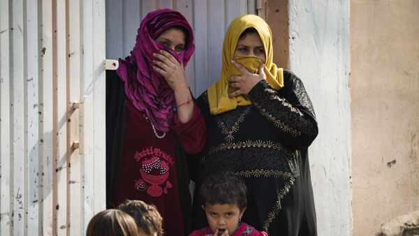 Žene i deca u Mosulu - Sputnik Srbija