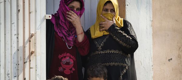 Жене и деца у Мосулу - Sputnik Србија