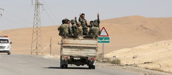 Сиријски војници у Палмири Сиријски војници у Палмири - Sputnik Србија