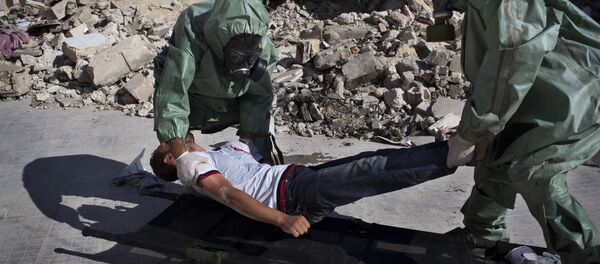 Volonteri učestvuju u simulaciji reagovanja na hemijski napad u severnom sirijskom gradu Alepu - Sputnik Srbija