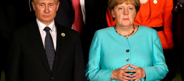 Ruski predsednik Vladimir Putin i nemačka kancelarka Angela Merkel - Sputnik Srbija