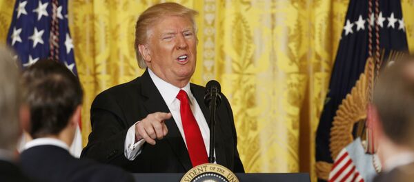 U.S. President Donald Trump gestures as he leaves the podium after a news conference at the White House in Washington, U.S., February 16, 2017. - Sputnik Србија