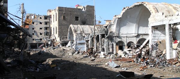 Уништене зграде у источном сиријском граду Дејр ел Зор - Sputnik Србија