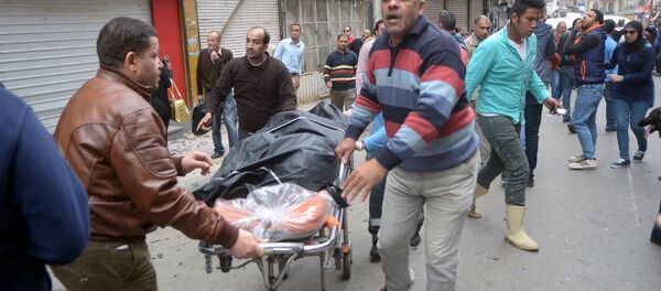 Žrtve bombaša samoubice ispred crkve u Aleksandriji. - Sputnik Srbija