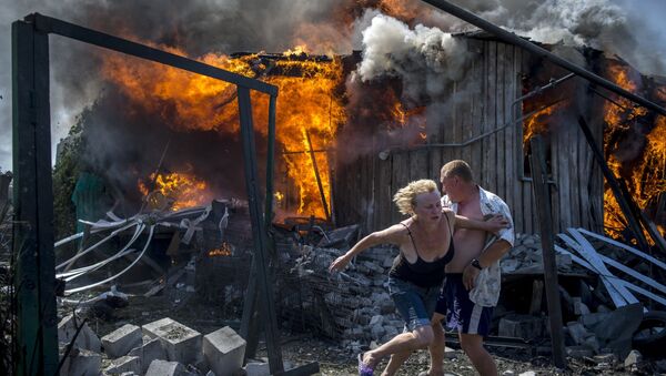 Crni dani Ukrajine: Rat i tuga kroz objektiv Sputnjikovog reportera - Sputnik Srbija
