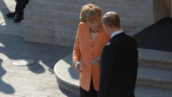 Немачка канцеларка Ангела Меркел и председник Русије Владимир Путин на састанку Г20 - Sputnik Србија